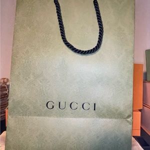 Gucci paper gift bag, green with black handles in good condition